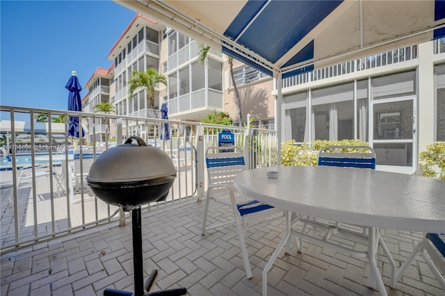 view of patio / terrace with outdoor dining space and grilling area