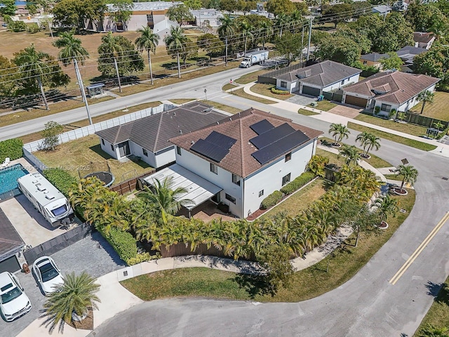 birds eye view of property with a residential view