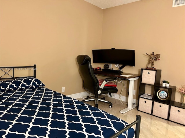 bedroom with visible vents and baseboards