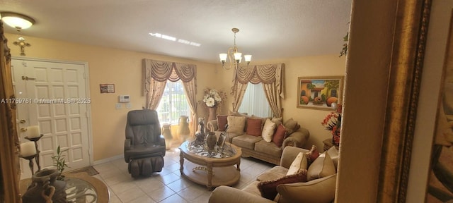 living area featuring light tile patterned floors, baseboards, and a notable chandelier