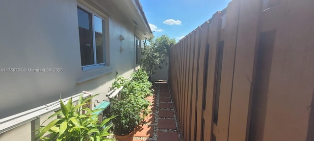 view of side of property with fence