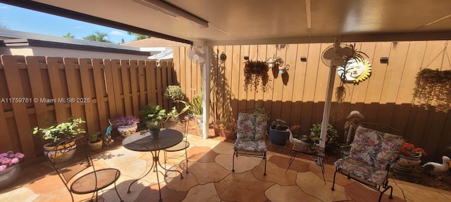 view of patio / terrace featuring fence