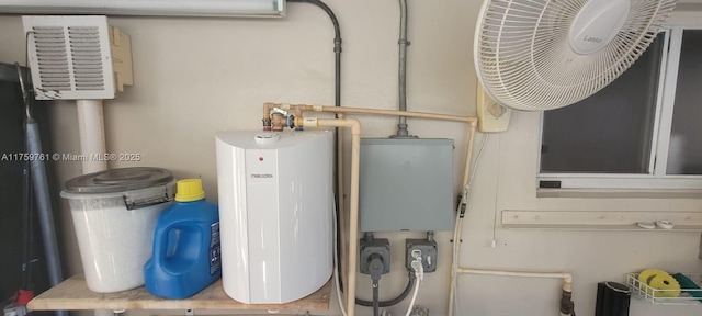 utility room with water heater