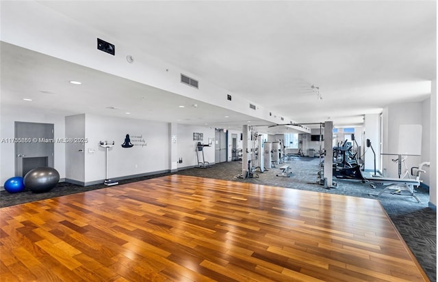 gym with hardwood / wood-style flooring, baseboards, visible vents, and recessed lighting