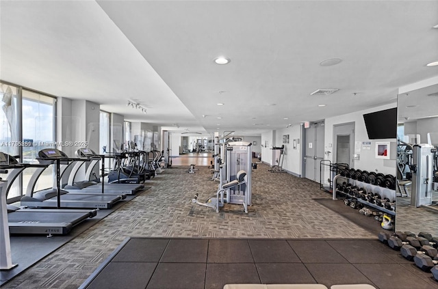 exercise room with carpet, visible vents, and recessed lighting