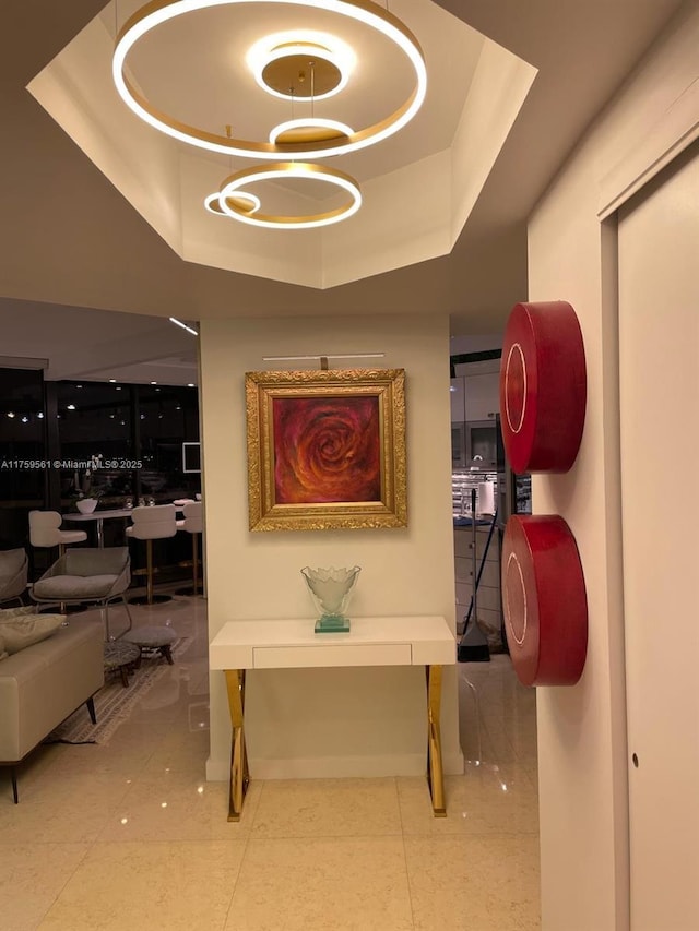 3610 Yacht Club Dr Unit 1510, Aventura, FL 33180 - hallway with a tray ceiling and tile patterned flooring
