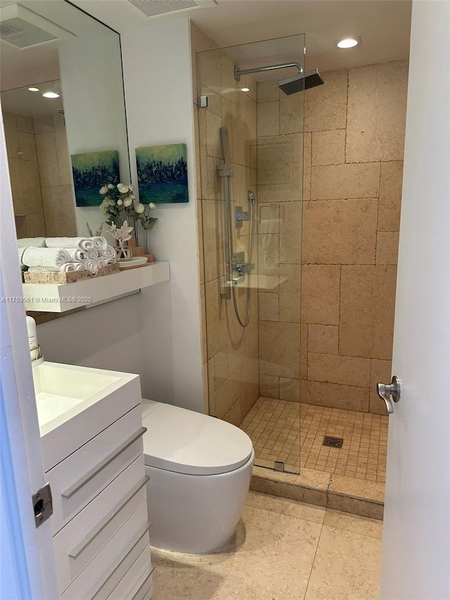 3610 Yacht Club Dr Unit 1510, Aventura, FL 33180 - bathroom featuring visible vents, tiled shower, toilet, tile patterned flooring, and vanity