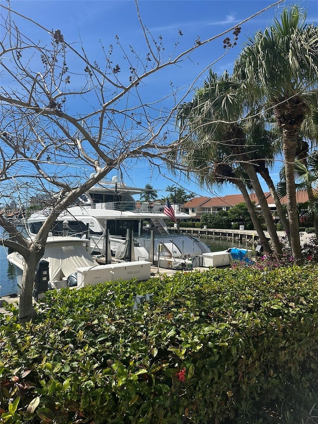 3610 Yacht Club Dr Unit 1510, Aventura, FL 33180 - exterior space with a dock, a water view, and boat lift