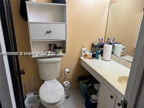 bathroom with toilet and vanity