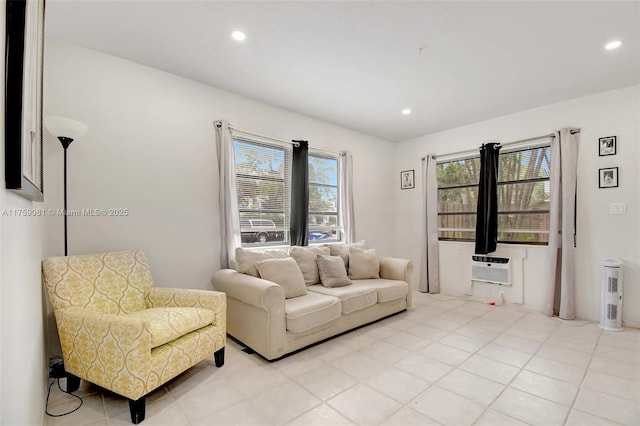 living room with recessed lighting, a wall mounted air conditioner, and light tile patterned flooring