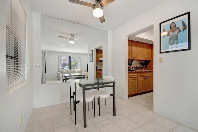 dining room with light tile patterned floors, a ceiling fan, and recessed lighting