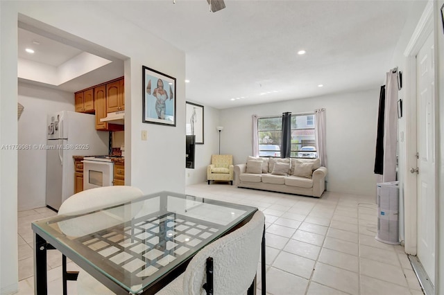 dining area with light tile patterned floors and recessed lighting