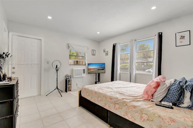 bedroom with a wall mounted air conditioner and recessed lighting