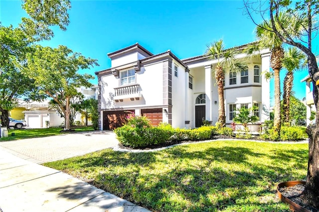 4951 SW 158th Ave, Miramar, FL 33027 - mediterranean / spanish home featuring stucco siding, an attached garage, a front yard, and driveway