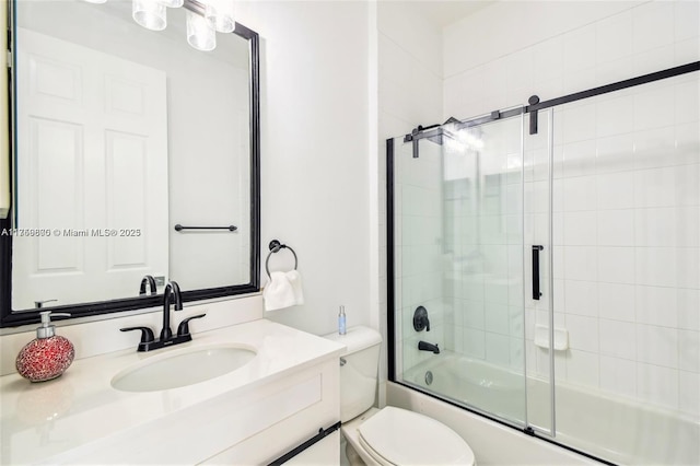 full bathroom with toilet, bath / shower combo with glass door, and vanity