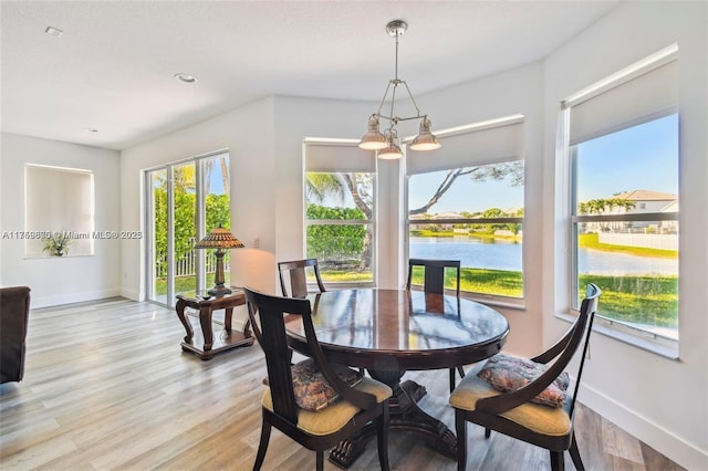 4951 SW 158th Ave, Miramar, FL 33027 - dining room featuring a chandelier, light wood-style floors, a water view, and recessed lighting