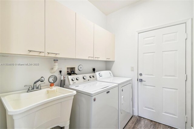 4951 SW 158th Ave, Miramar, FL 33027 - laundry room with washing machine and clothes dryer, wood finished floors, and cabinet space
