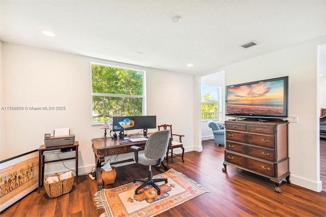 office space featuring recessed lighting, wood finished floors, visible vents, and baseboards