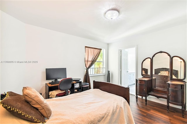 bedroom with dark wood-style floors