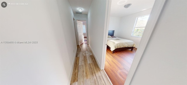 4951 SW 158th Ave, Miramar, FL 33027 - corridor with light wood-style floors and baseboards