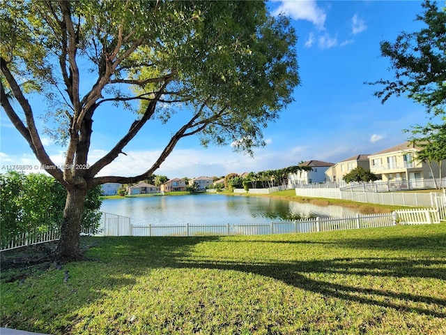 water view featuring fence and a residential view