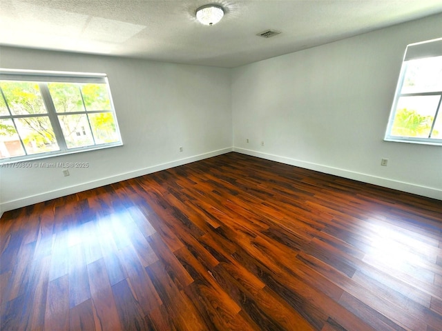 4951 SW 158th Ave, Miramar, FL 33027 - spare room with healthy amount of natural light and dark wood-style flooring