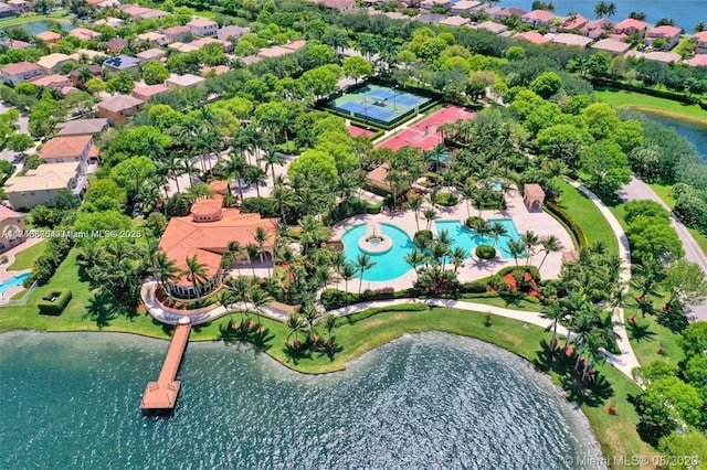 drone / aerial view with a residential view and a water view