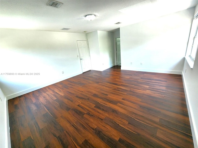 4951 SW 158th Ave, Miramar, FL 33027 - empty room featuring dark wood-style floors and a textured ceiling