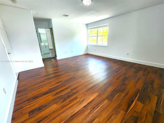 4951 SW 158th Ave, Miramar, FL 33027 - empty room featuring dark wood-style flooring and a textured ceiling