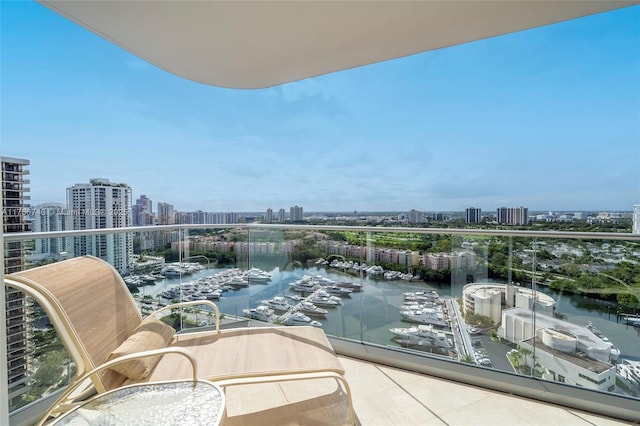 balcony featuring a water view and a view of city