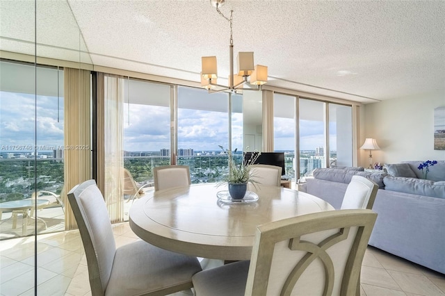 dining area with light tile patterned floors, a notable chandelier, floor to ceiling windows, and a city view
