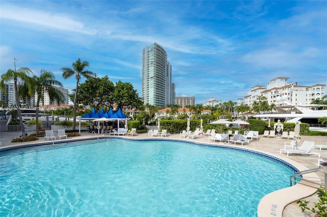 pool with a view of city and a patio