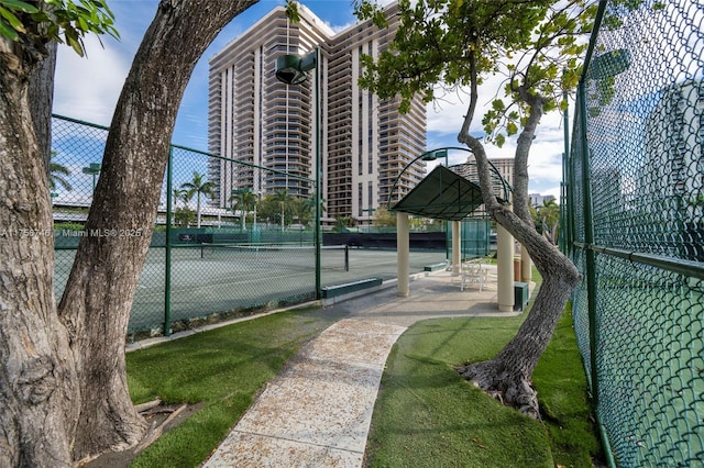 view of tennis court with fence
