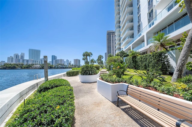 view of community featuring a water view and a city view