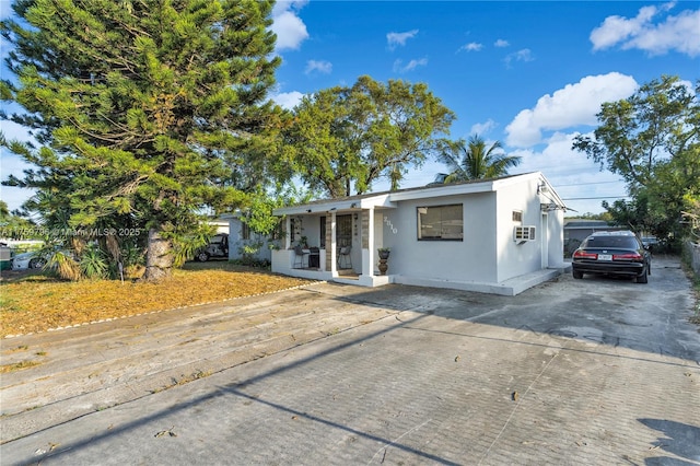 ranch-style house with stucco siding