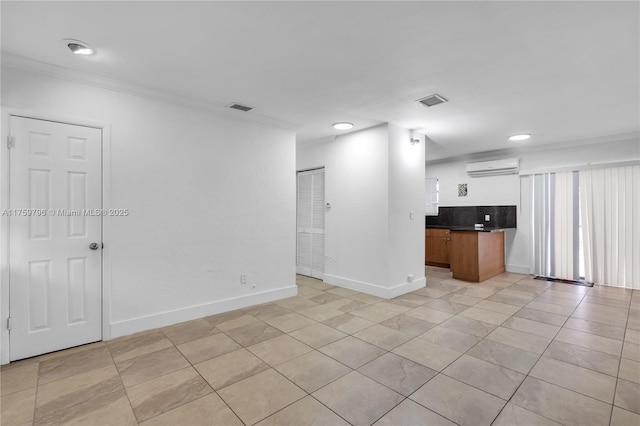 2810 NW 171st Ter, Miami Gardens, FL 33056 - unfurnished living room with a wall unit AC, crown molding, light tile patterned flooring, and recessed lighting
