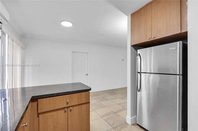 2810 NW 171st Ter, Miami Gardens, FL 33056 - kitchen featuring freestanding refrigerator, crown molding, a wall mounted air conditioner, dark stone countertops, and light tile patterned floors
