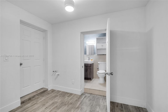 2810 NW 171st Ter, Miami Gardens, FL 33056 - corridor featuring wood finish floors and baseboards