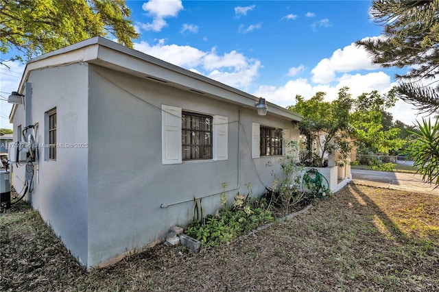 view of property exterior with stucco siding