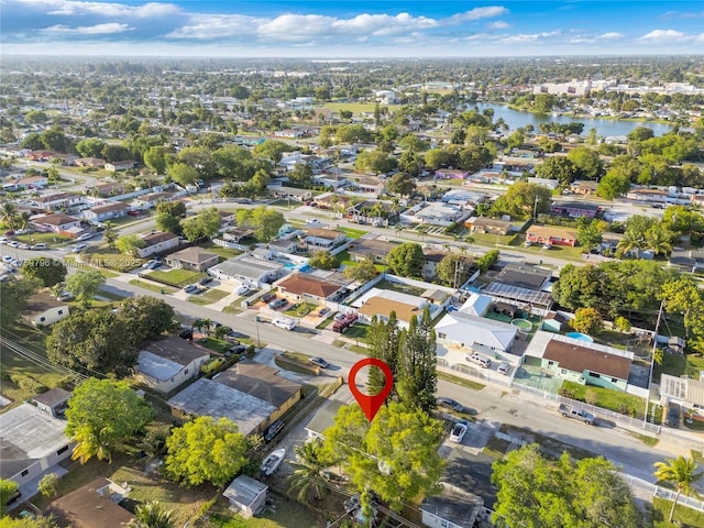 bird's eye view featuring a residential view and a water view