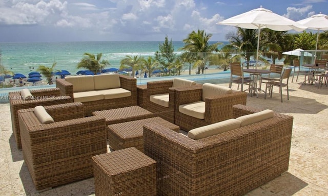 view of patio featuring outdoor lounge area and a water view