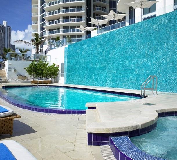 pool with a hot tub