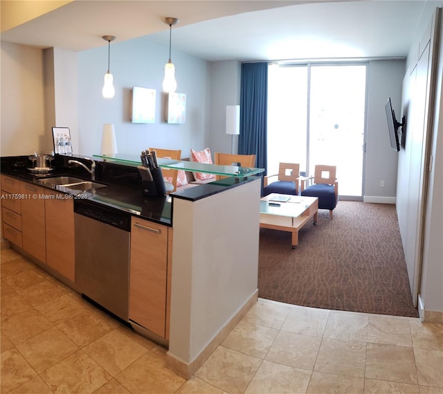 kitchen featuring light carpet, dishwasher, dark countertops, floor to ceiling windows, and a sink