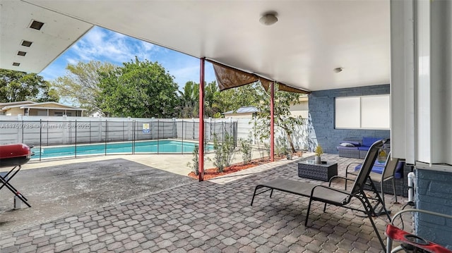 view of swimming pool featuring a fenced in pool, fence, and a patio area