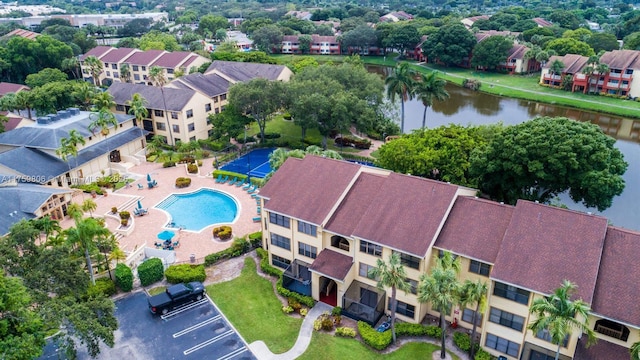 birds eye view of property with a water view and a residential view