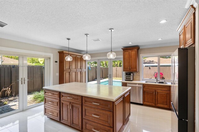 17 Boxwood Rd, Hollywood, FL 33021 - kitchen with a sink, brown cabinetry, french doors, and stainless steel appliances
