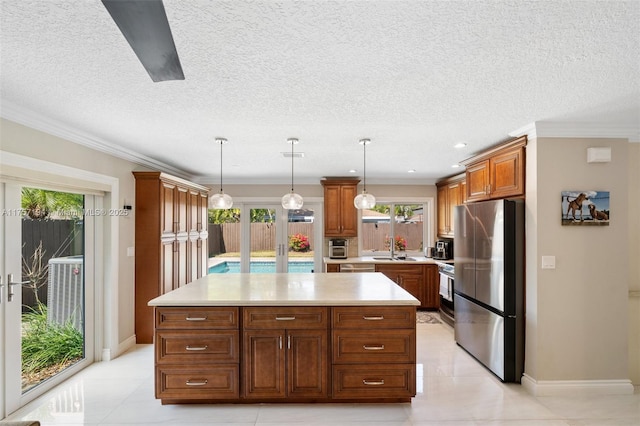 17 Boxwood Rd, Hollywood, FL 33021 - kitchen featuring a sink, a kitchen island, freestanding refrigerator, light countertops, and range