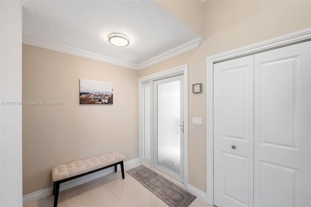 17 Boxwood Rd, Hollywood, FL 33021 - foyer entrance with ornamental molding, baseboards, light tile patterned floors, and a textured ceiling