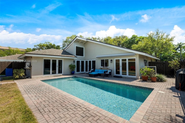 17 Boxwood Rd, Hollywood, FL 33021 - view of swimming pool featuring a patio, a fenced in pool, fence, french doors, and outdoor lounge area