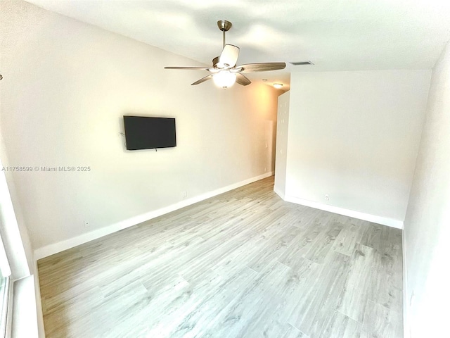 unfurnished room with light wood finished floors, visible vents, baseboards, and ceiling fan